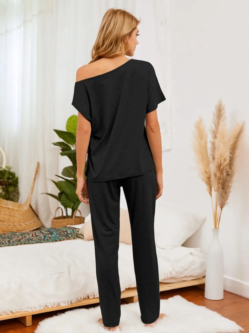Back view highlighting top and pants silhouette