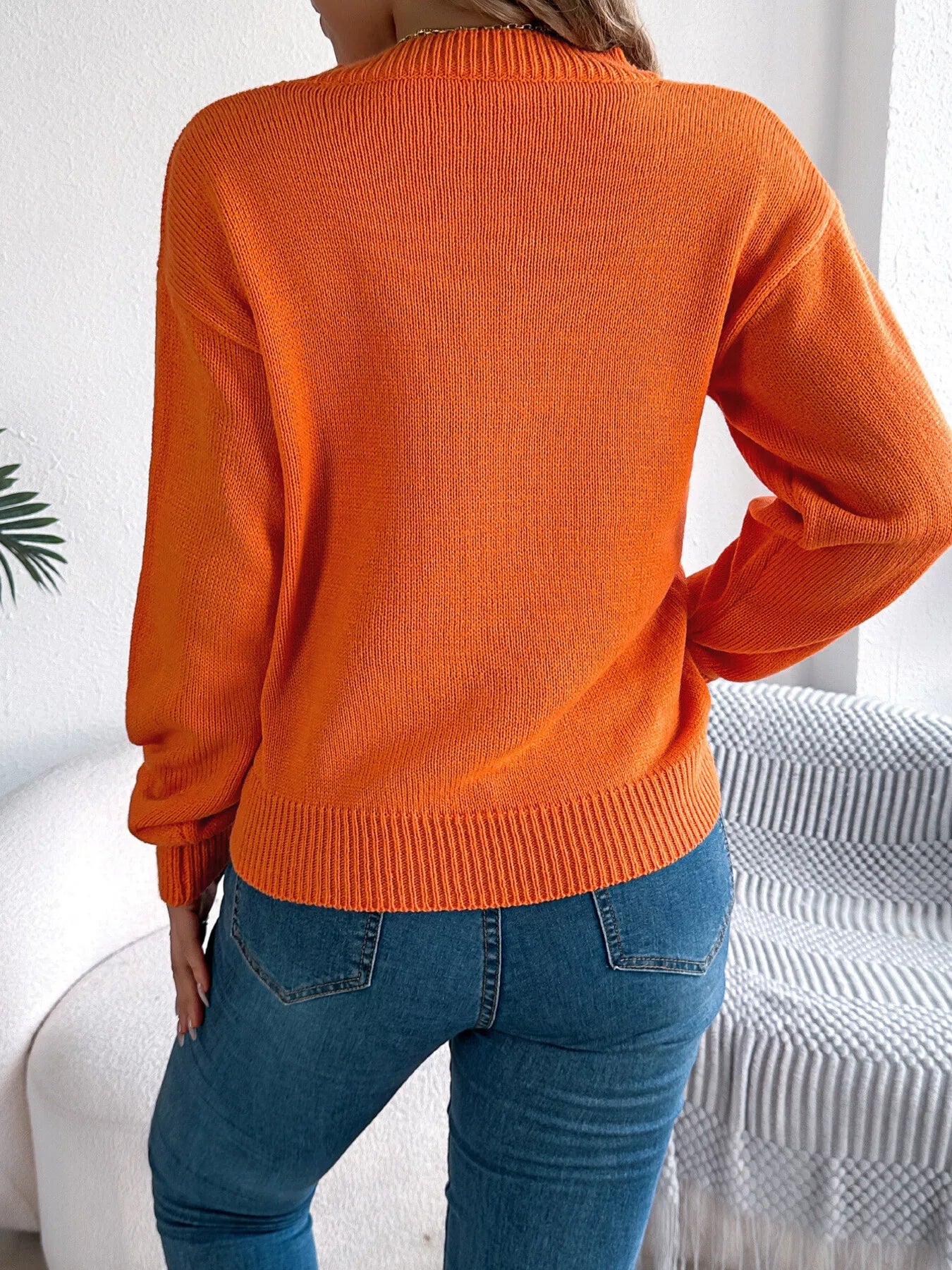 Back view of openwork round neck long sleeve sweater breathable knit pattern