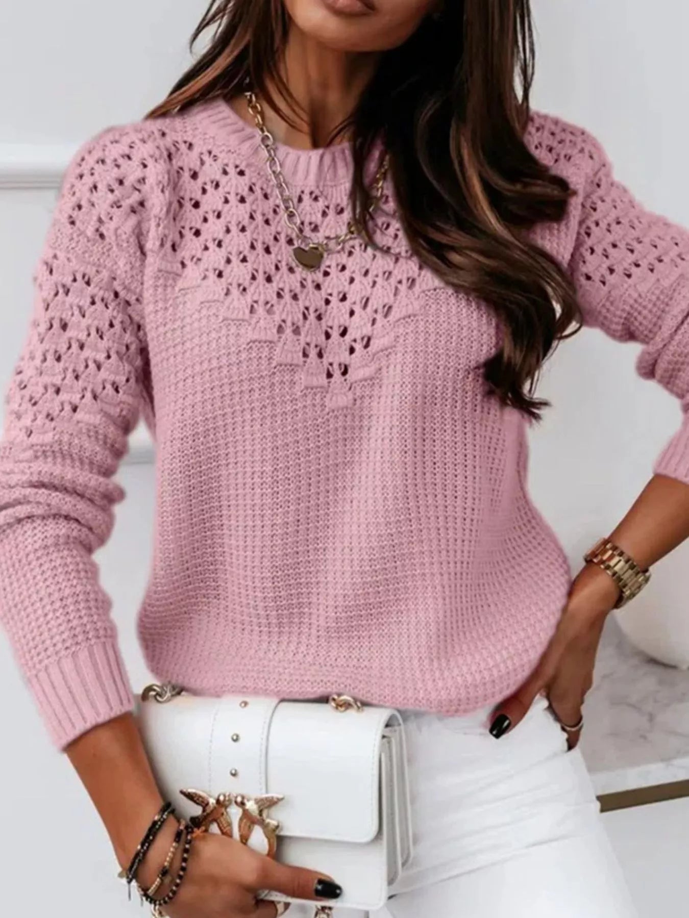 Front angled view of openwork round neck sweater with breathable design