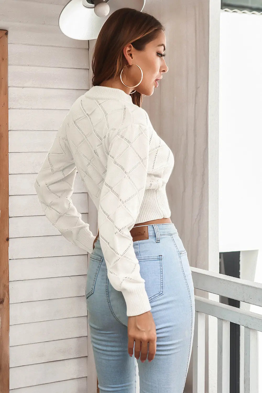 Side angle view showing fit of cropped plaid sweater