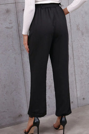 Back view of belted paperbag waist pants showing fit and silhouette