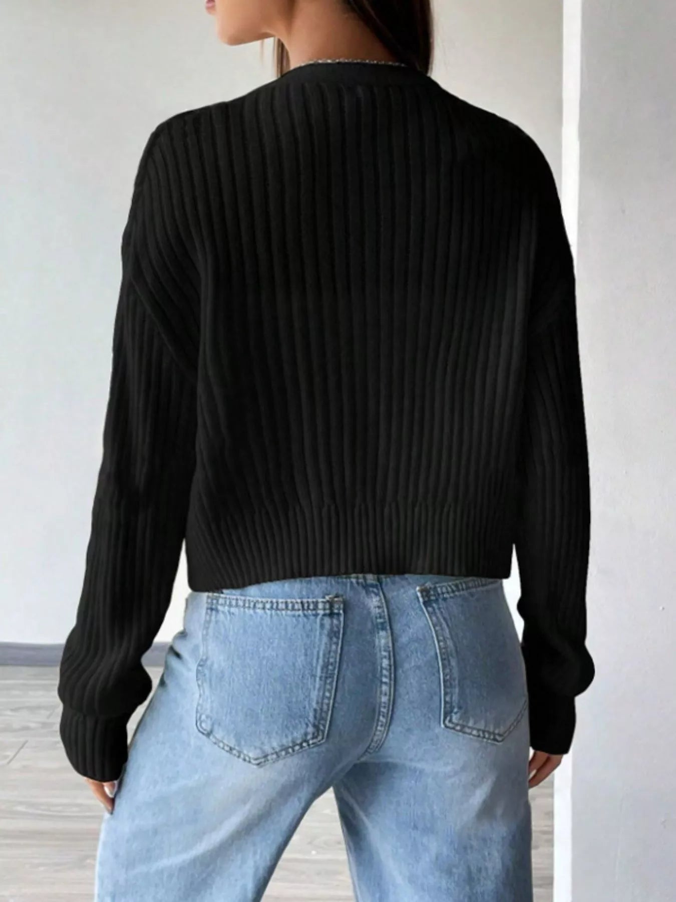 Back view of ribbed knit button-up cropped cardigan