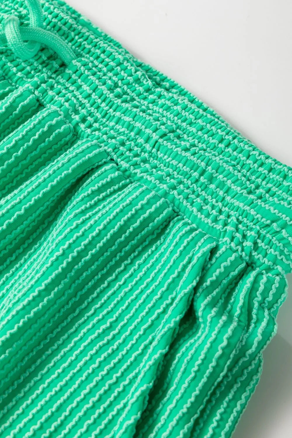 Close up display of ribbed knit round neck top and pants set