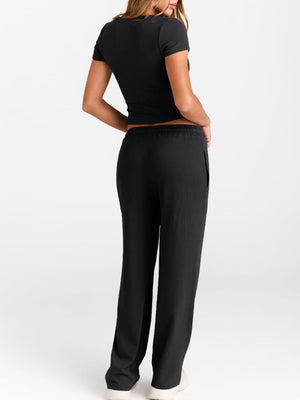 Back detail of short sleeve tee and pants outfit