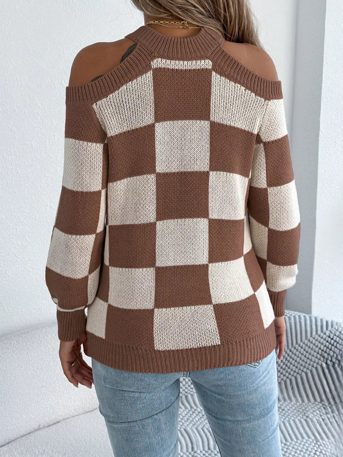 Back side of long sleeve checkered sweater
