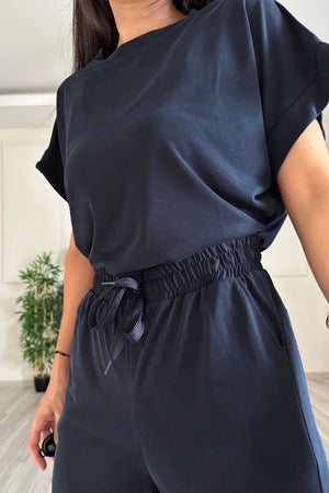 Model wearing the set in casual pose