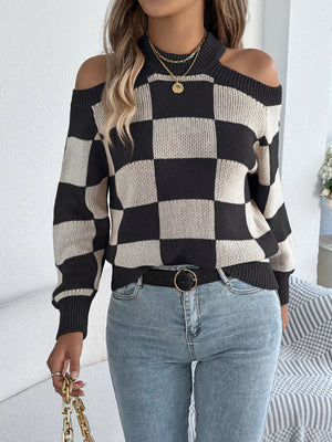 Full body front view of checkered cold shoulder sweater