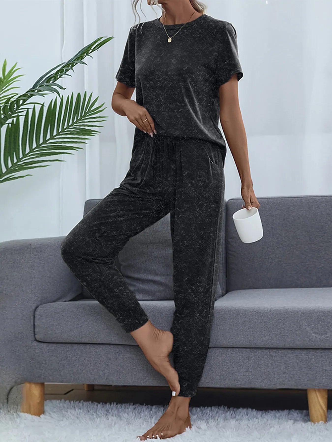 Model wearing Round Neck Short Sleeve Top and Pants Lounge Set