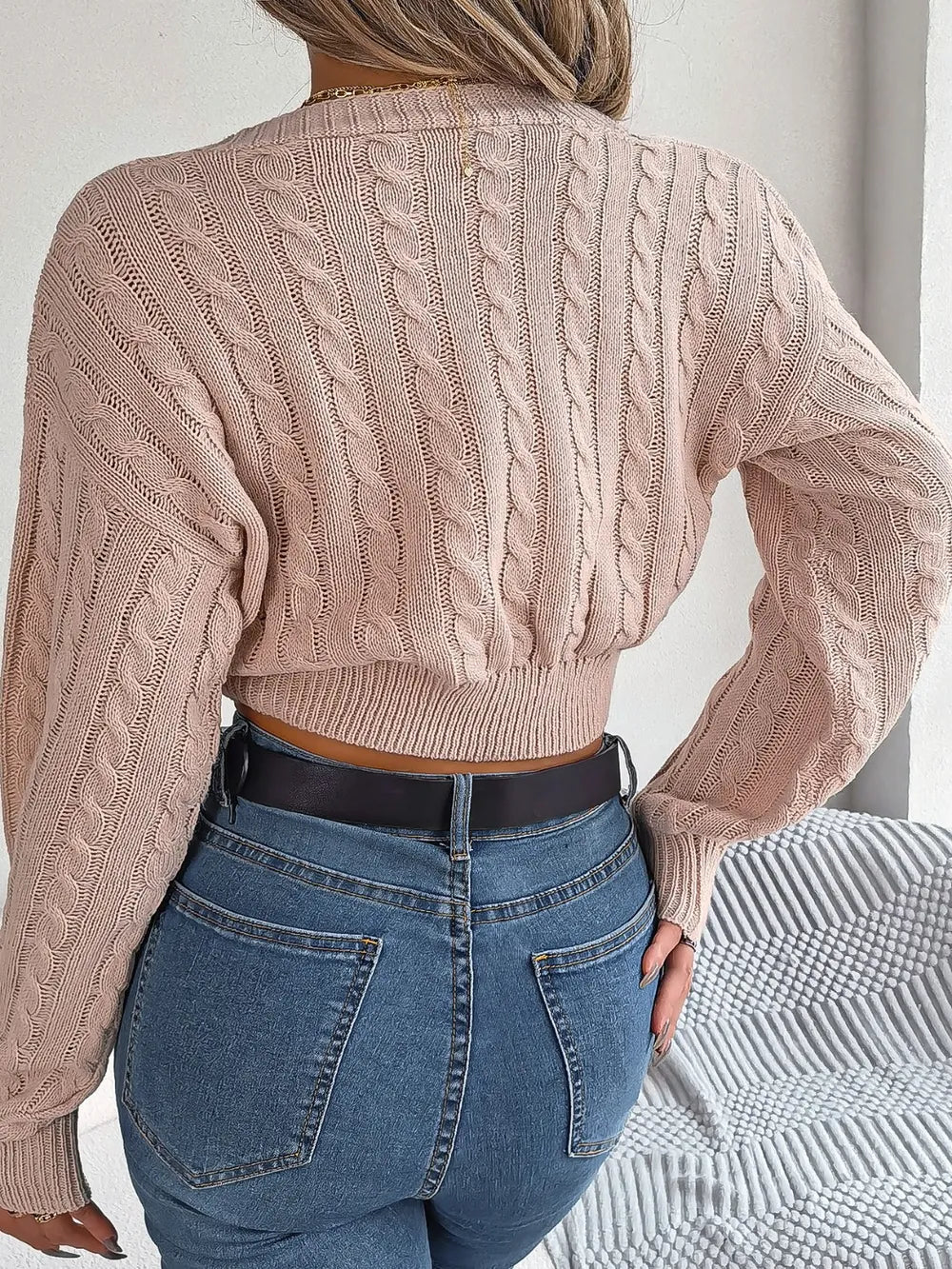 Twisted cable knit V-neck sweater back view long sleeve cozy design