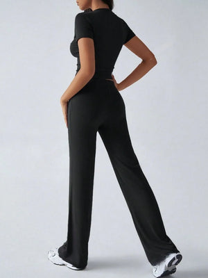 Back styling view of round neck short sleeve top and pants set