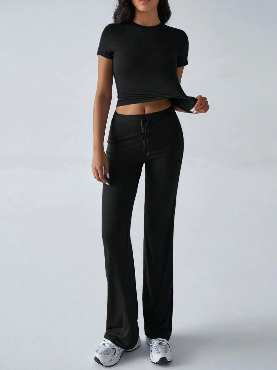 Front styling view of round neck short sleeve top and pants set