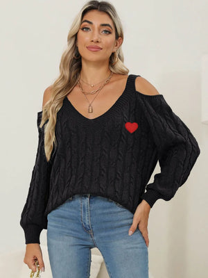 Front angle of Cable-Knit Heart V-Neck Sweater with detailed knit pattern