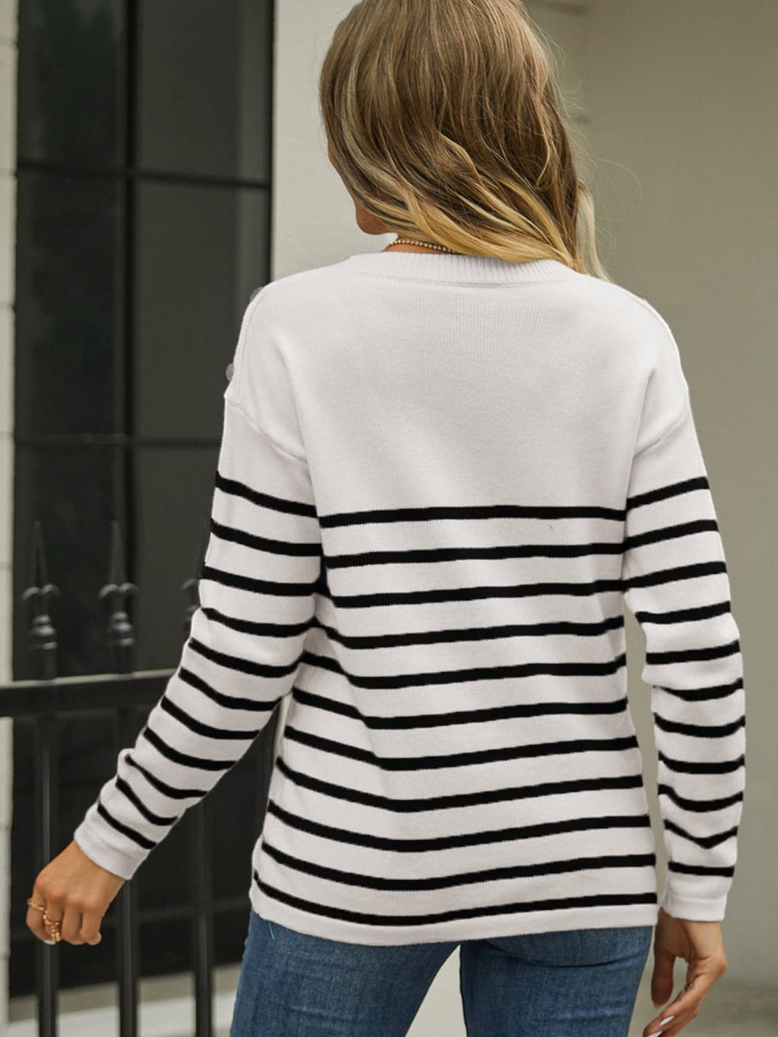Back view of angel wings striped sweater with round neck design
