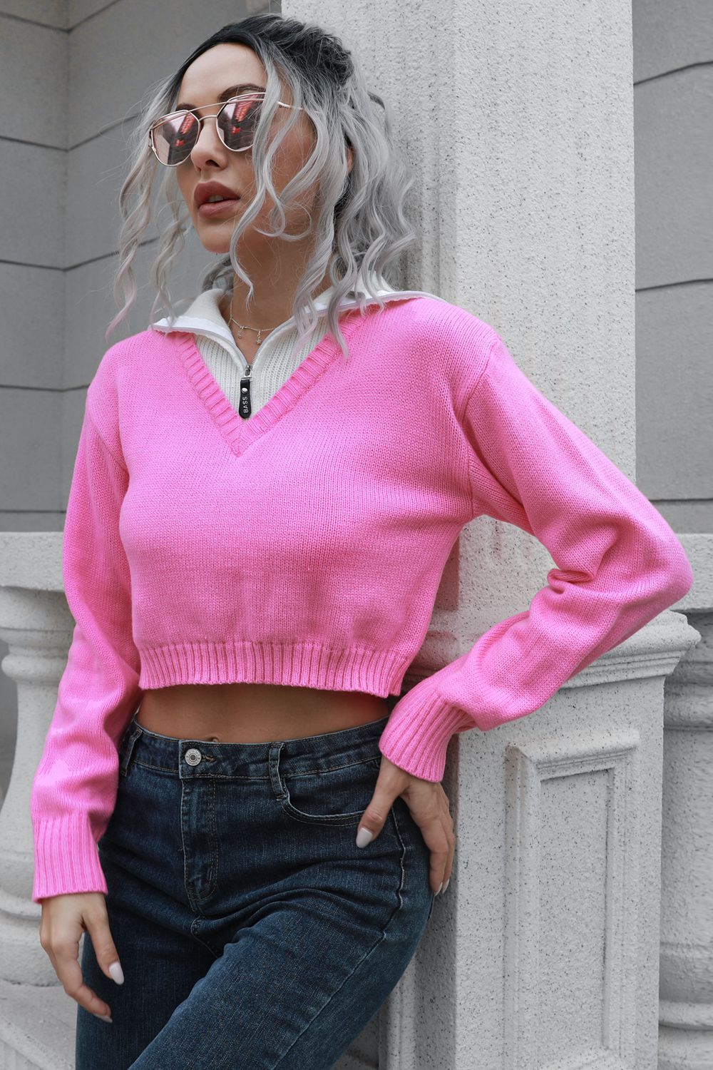 Slight side angle view of contrast collared cropped sweater