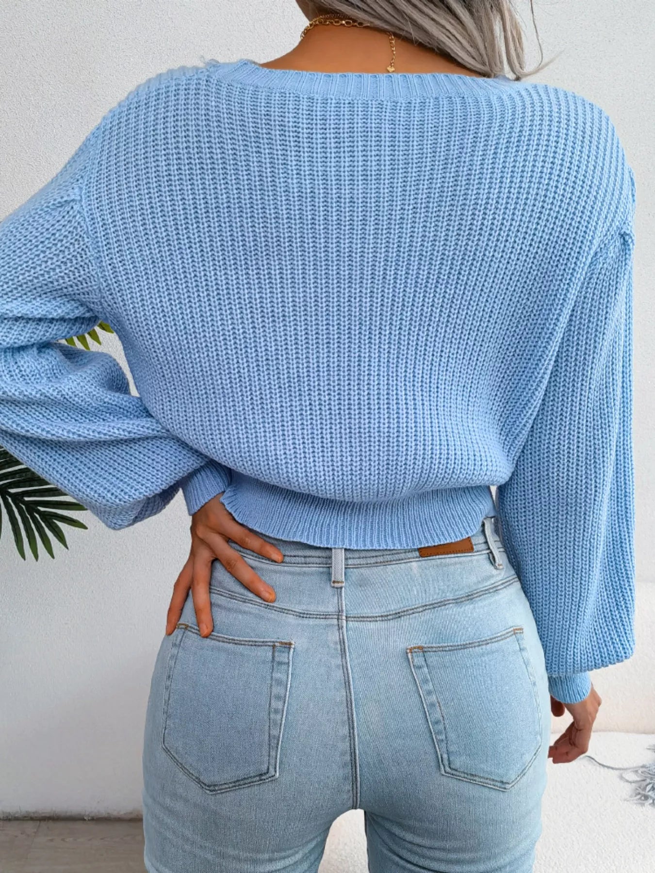 Rear view of cable knit cropped sweater