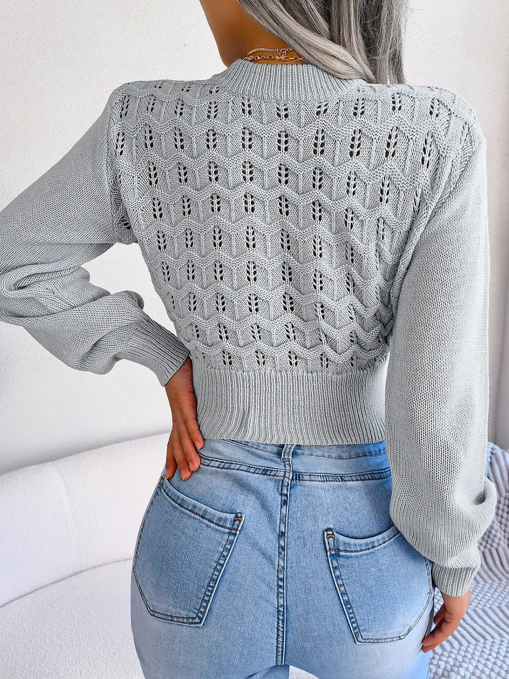 Back design of mock neck openwork cropped sweater