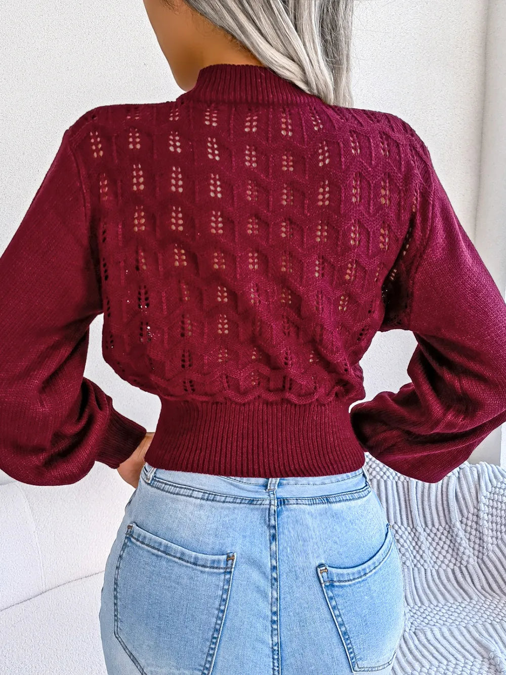 Back view of openwork mock neck long sleeve cropped sweater