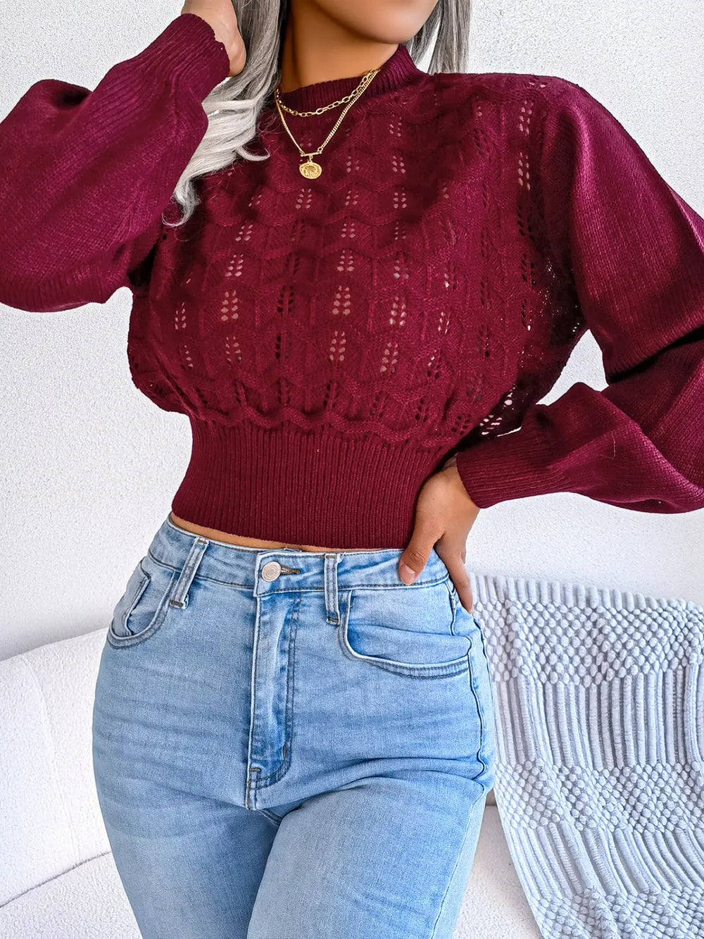 Side view of openwork mock neck cropped sweater