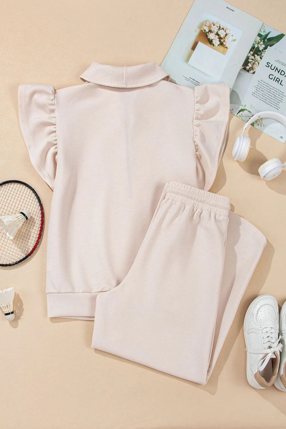 Display of textured ruffled sleeve top and pants set