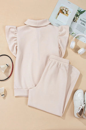 Display of textured ruffled sleeve top and pants set