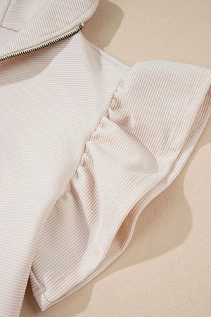 Detail of textured ruffled sleeve top and pants
