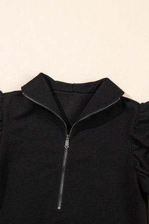 Flat display of textured ruffled sleeve top and pants