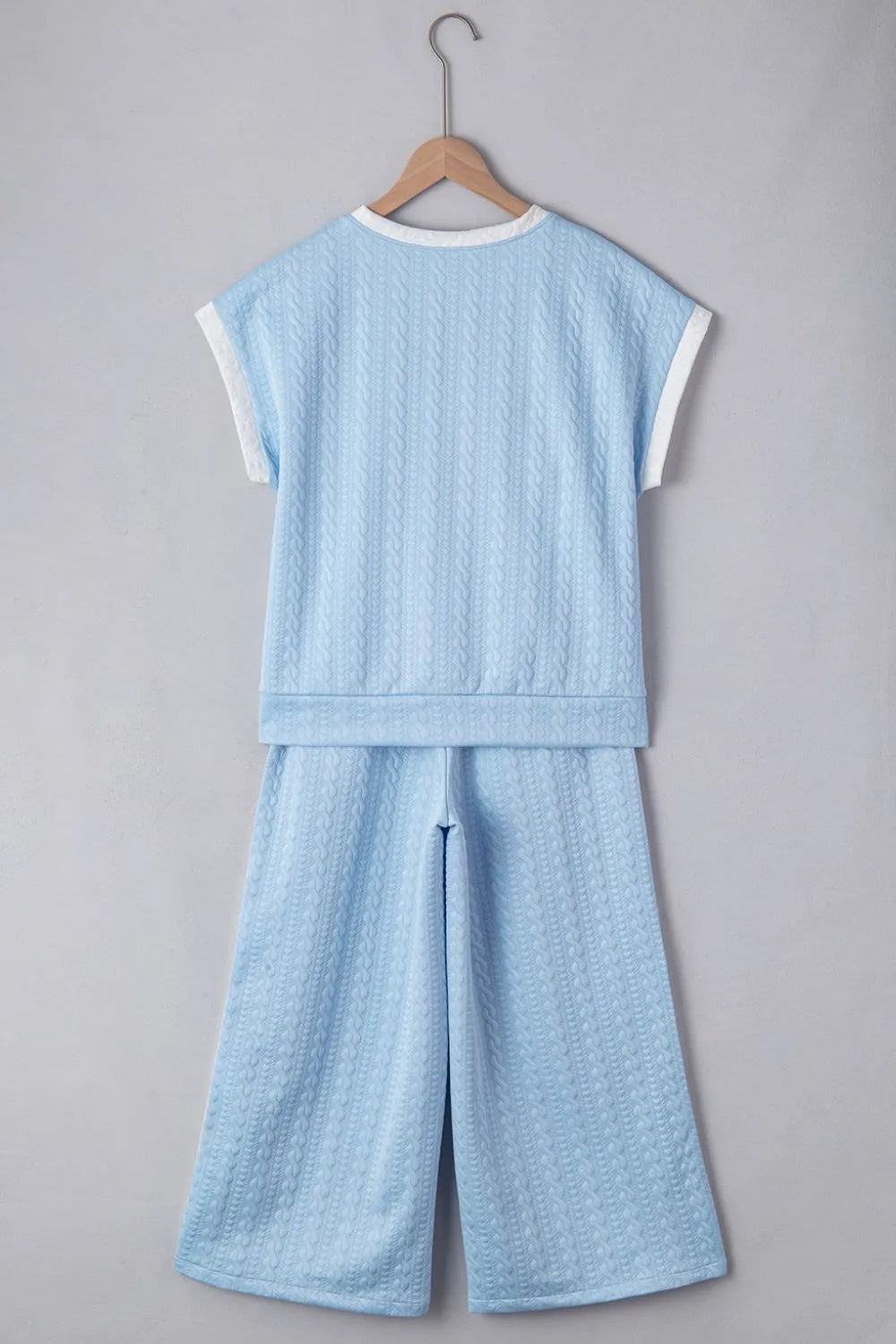 Two-piece textured outfit top and pants display