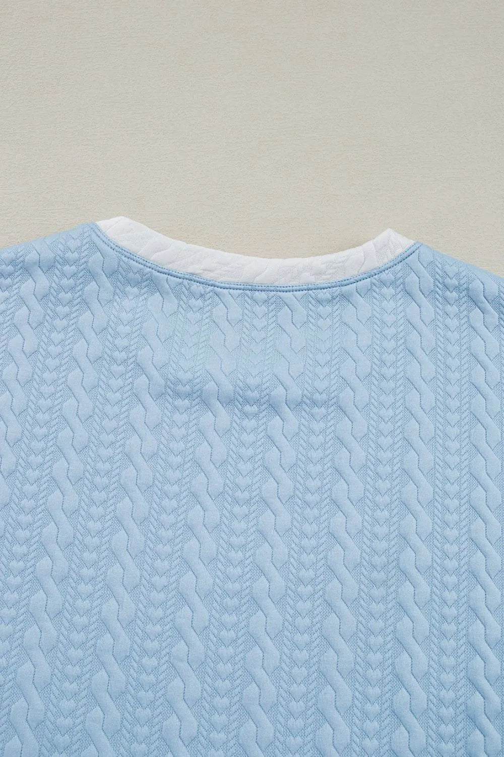 Textured top fabric and edge detailing