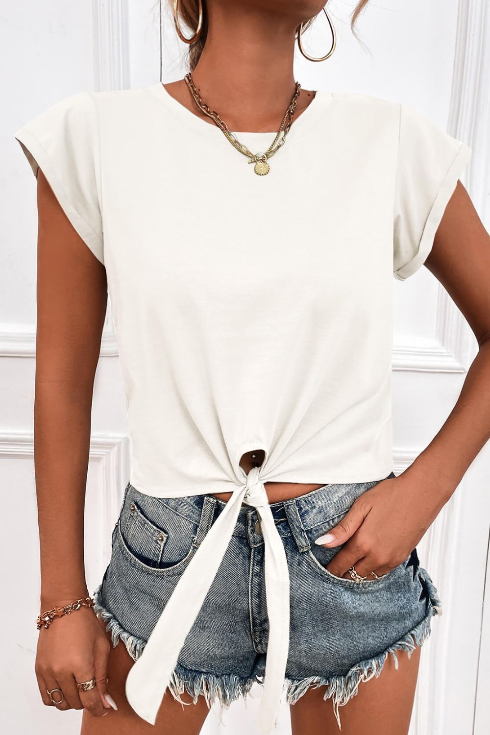Cropped tee front close-up showing stylish tie detail