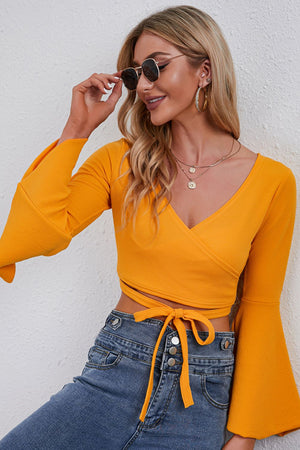 Stylish front look of tie front cropped top with flare sleeves