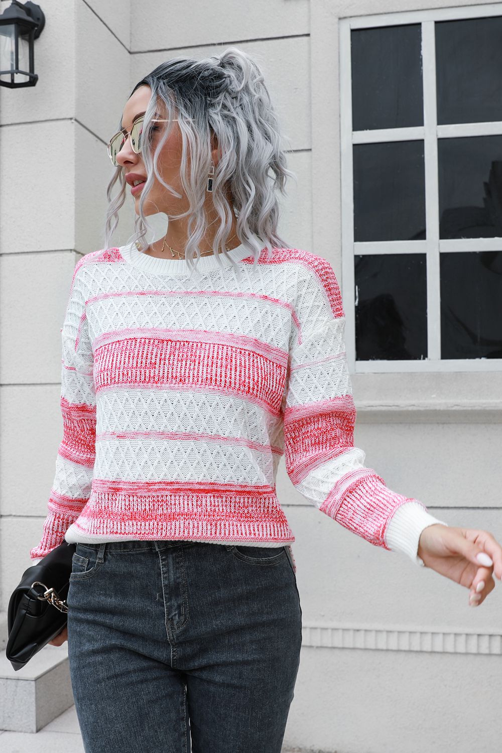 Front view of two-tone slit sweater design
