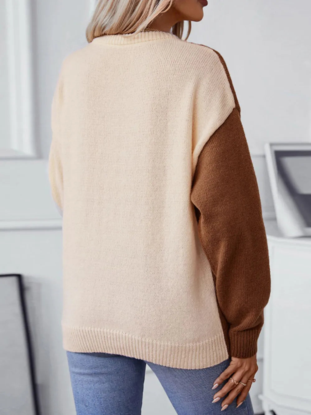 back view of two tone cable knit sweater long sleeve design