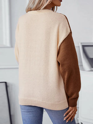 back view of two tone cable knit sweater long sleeve design