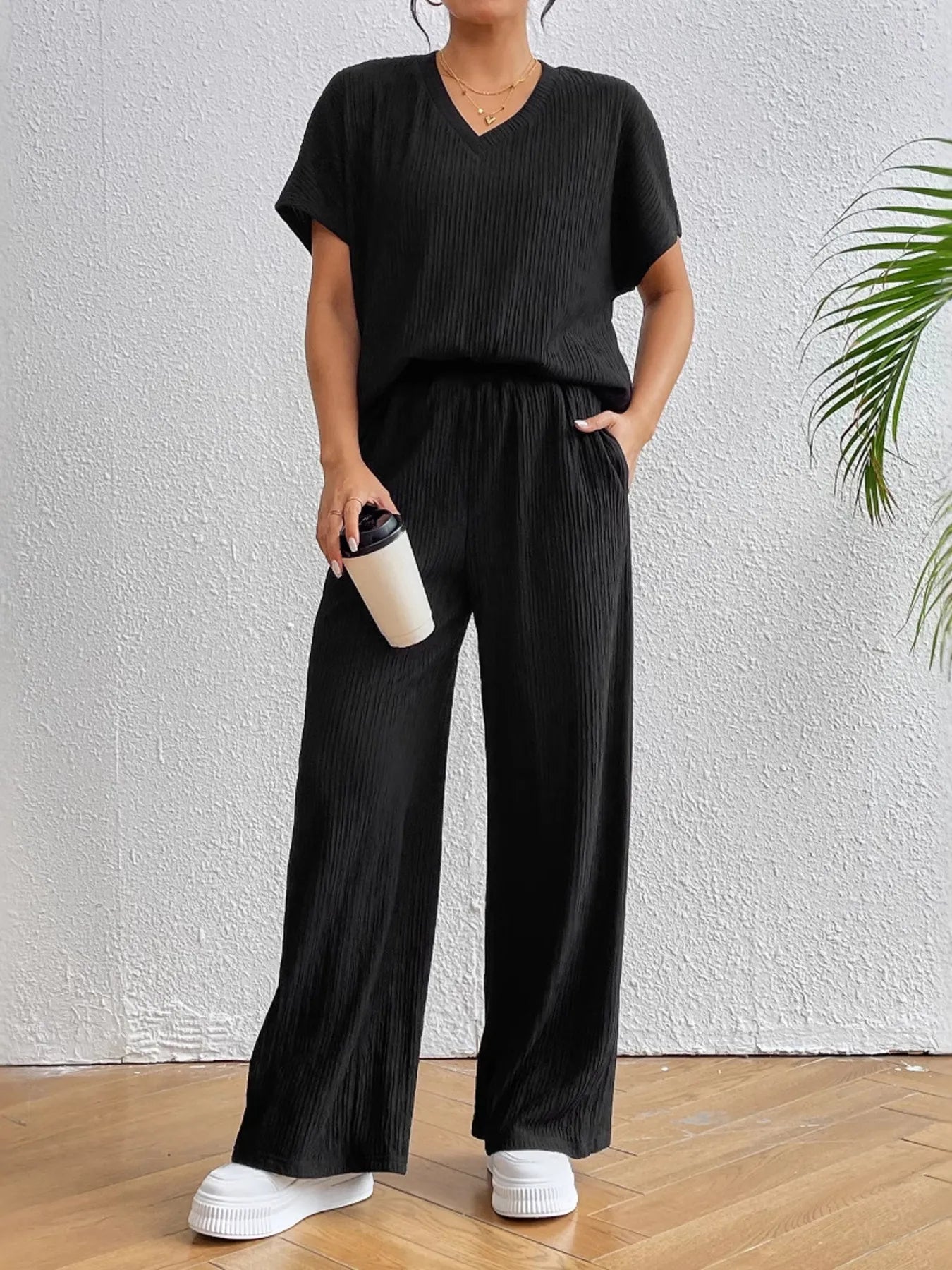 Front view of V-neck short sleeve top and pants set for women