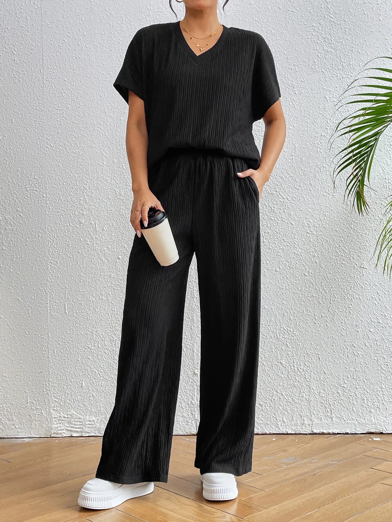Stylish front look of V-neck top and pants matching set