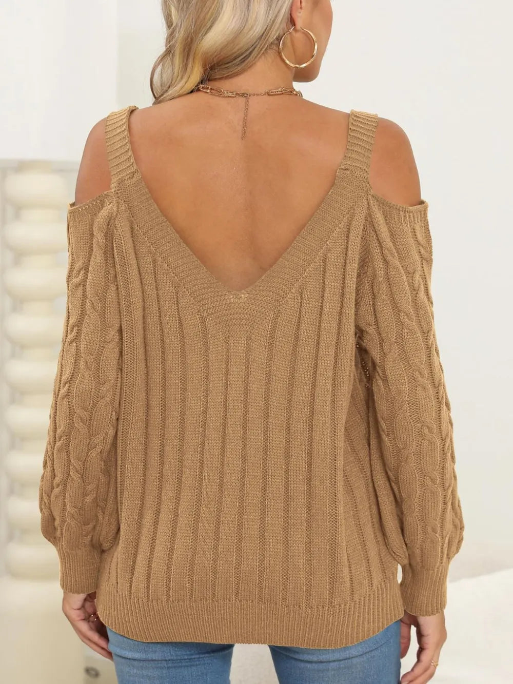 Rear view of Cable-Knit Heart V-Neck Sweater with cozy winter style