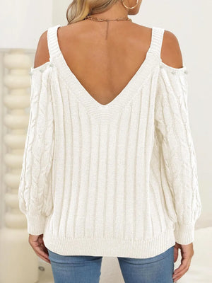 Back side of Cable-Knit Cold Shoulder Sweater with cable knit pattern