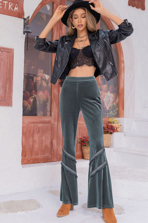 Front of long wide leg pants highlighting wide cut