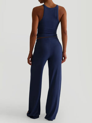 Back view showing outfit details and pants design