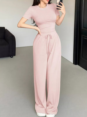 Model wearing round neck T-shirt and pants set